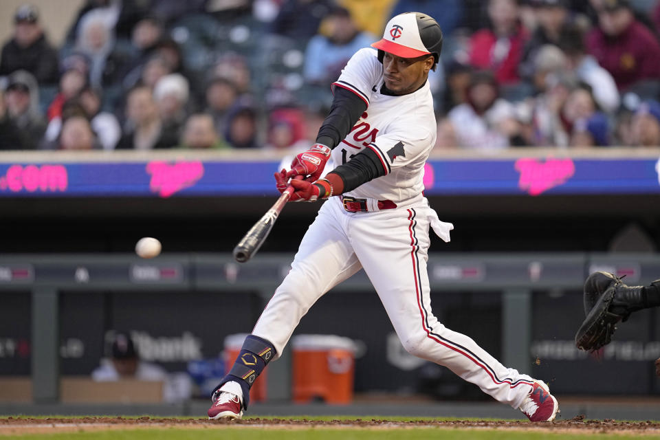 Minnesota Twins' Jorge Polanco hits a two-run single during the third inning of a baseball game against the New York Yankees, Monday, April 24, 2023, in Minneapolis. (AP Photo/Abbie Parr)