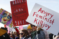 <p>Protestors gather to participate in a Women’s March highlighting demands for equal rights and equality for women, Saturday, Jan. 20, 2018, in Cincinnati, Ohio. (Photo: John Minchillo/AP) </p>