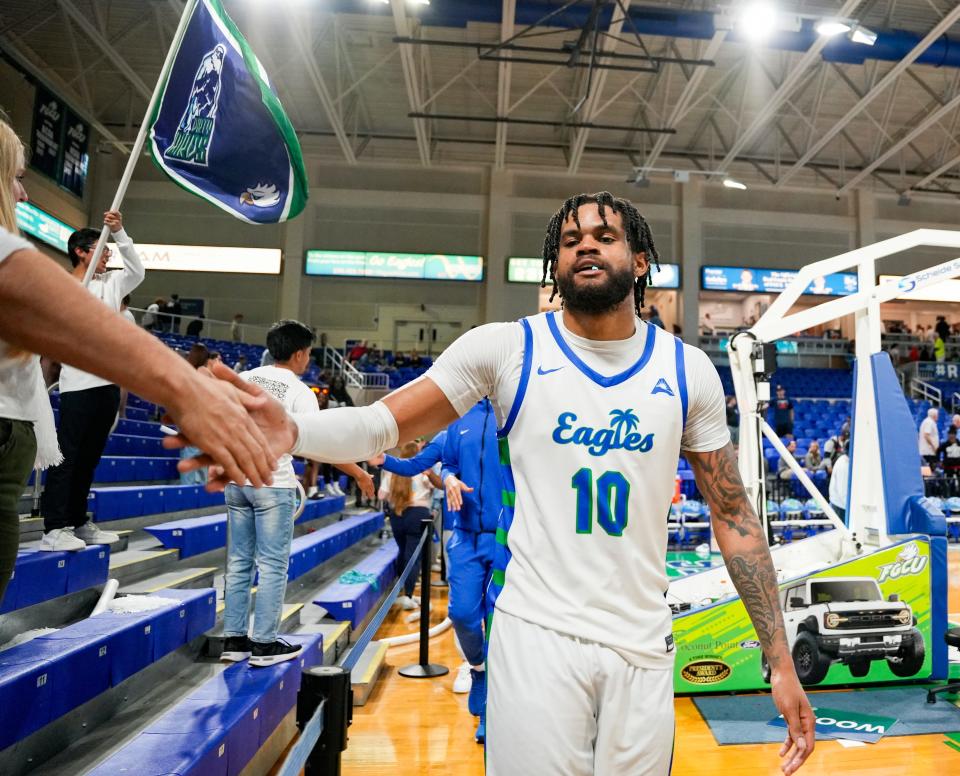 Florida Gulf Coast Eagles forward Zach Anderson (10) greets fans after defeating the Queens Royals in an ASUN conference game at Alico Arena in Fort Myers on Saturday, Feb. 24, 2024.