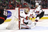 Ottawa Senators goaltender Anton Forsberg (31) makes a save against a shot by Carolina Hurricanes center Martin Necas (88) during first-period NHL hockey game action in Ottawa, Ontario, Sunday, March 17, 2024. (Justin Tang/The Canadian Press via AP)