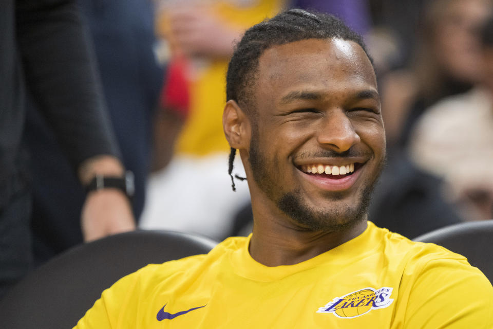 Los Angeles Lakers guard Bronny James laughs before an NBA summer league basketball game against Golden State Warriors in San Francisco , Sunday, July 7, 2024. (AP Photo/Nic Coury)