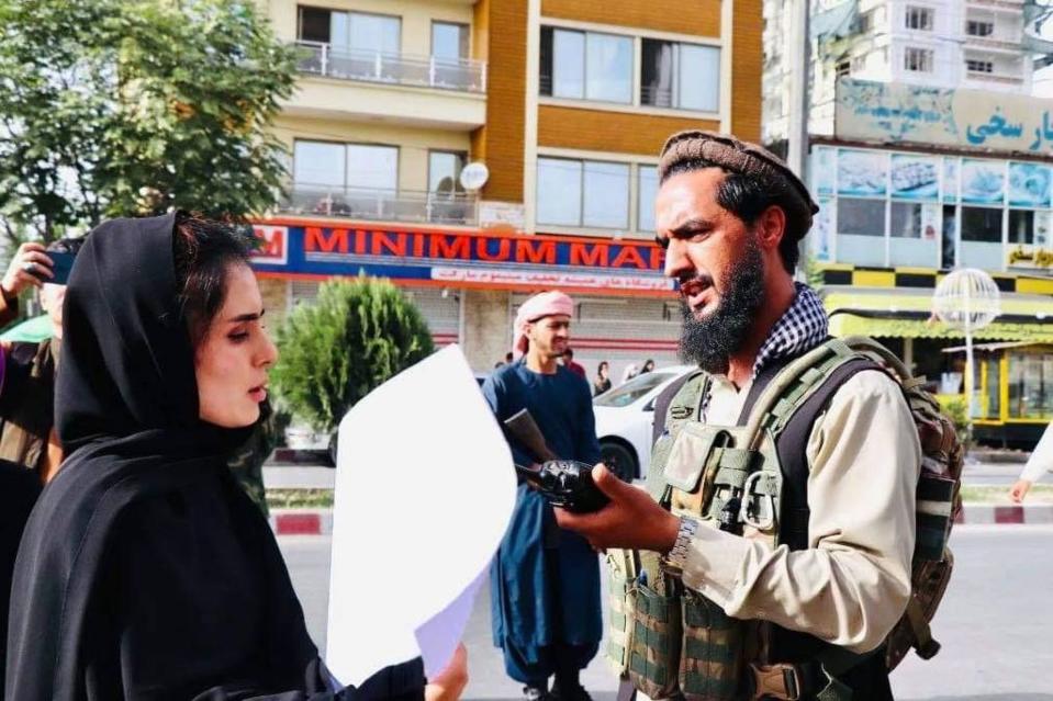 Crystal Bayat talks to a Talib soldier while protesting against the Taliban in Afghanistan. | Khaled Nora