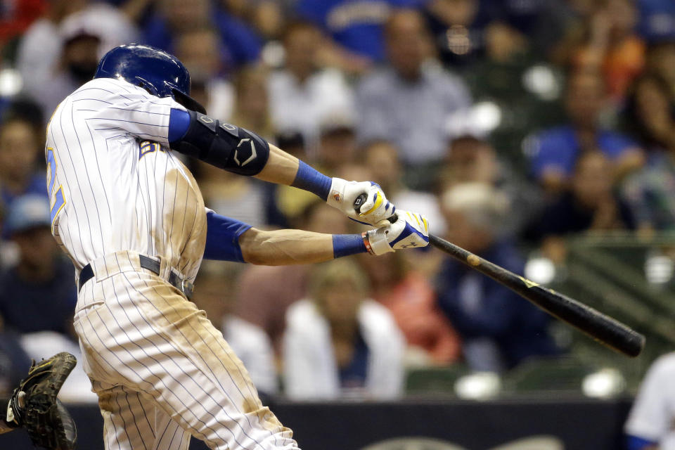 Milwaukee Brewers' Christian Yelich hits a winning RBI-double during the ninth inning of a baseball game against the Chicago Cubs, Saturday, Sept. 7, 2019, in Milwaukee. (AP Photo/Aaron Gash)