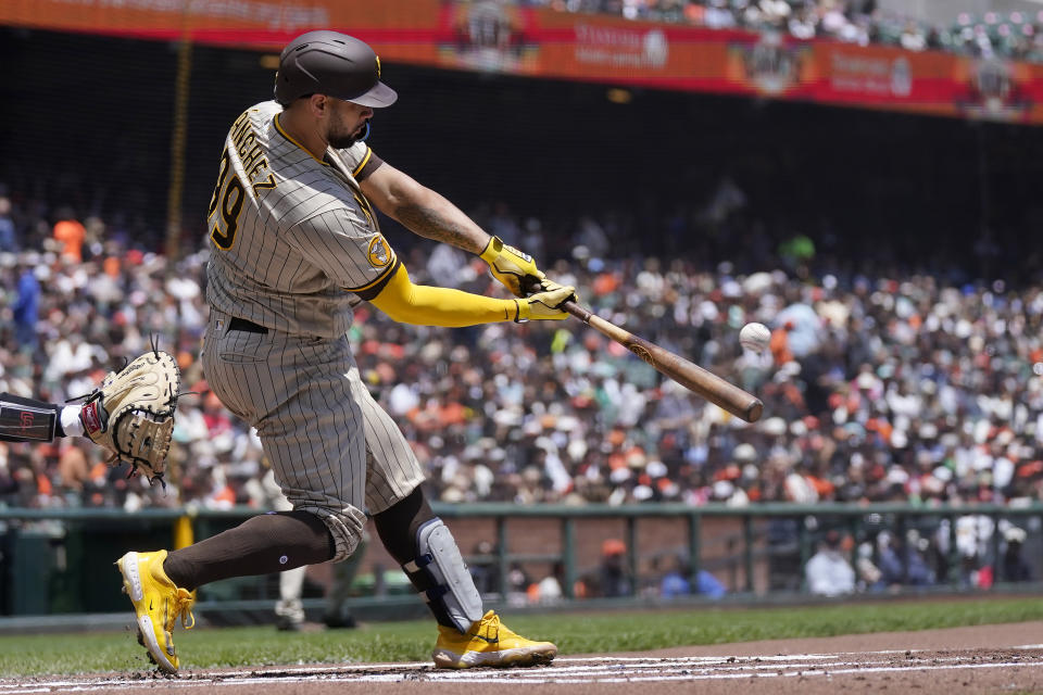 San Diego Padres' Gary Sanchez hits a three-run home run against the San Francisco Giants during the first inning of a baseball game in San Francisco, Thursday, June 22, 2023. (AP Photo/Jeff Chiu)