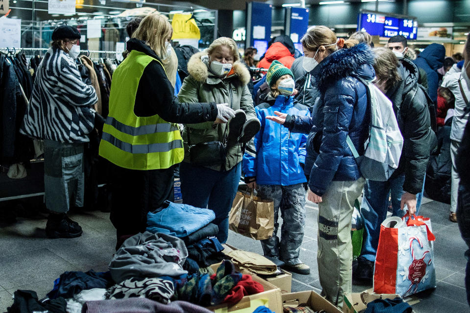 BERLIN, GERMANY - MARCH 06: People fleeing war-torn Ukraine look for clothing after arriving on a train from Poland at the Hauptbahnhof main railway station on March 6, 2022 in Berlin, Germany. Over one million people, mainly Ukrainian women and children as well as foreigners living or working in Ukraine, have fled Ukraine as the current Russian military invasion continues to inflict growing casualties on the civilian population. (Photo by Carsten Koall/Getty Images)