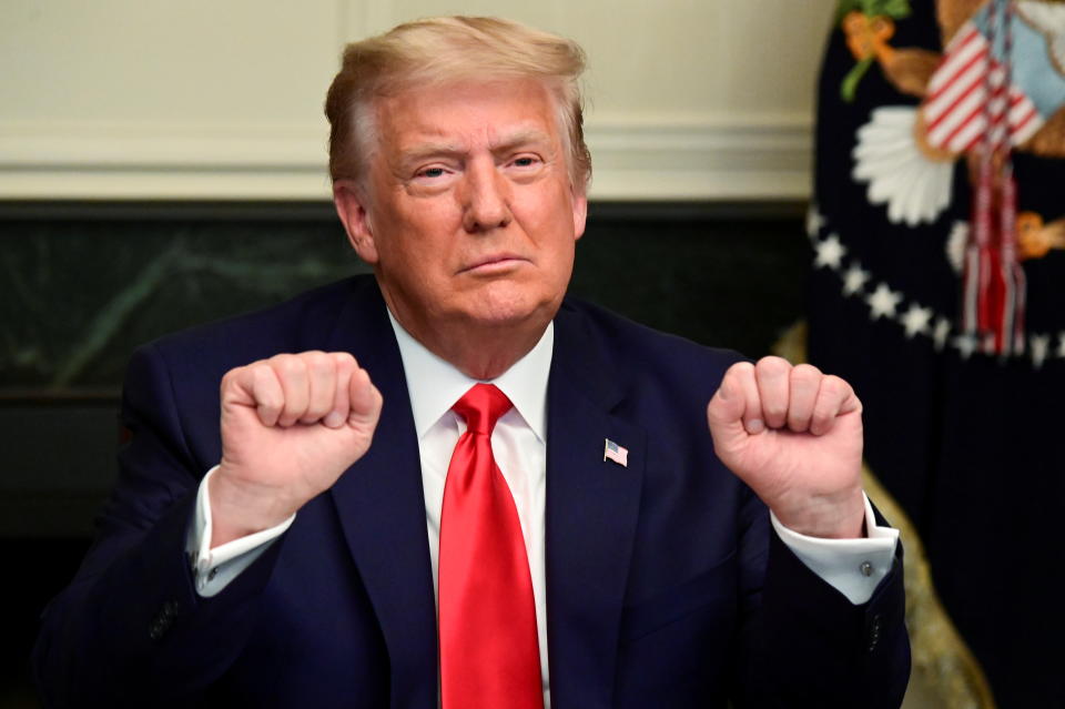 U.S. President Donald Trump gestures as he participates in a Thanksgiving video teleconference with members of the military forces at the White House in Washington, U.S., November 26, 2020.  REUTERS/Erin Scott     TPX IMAGES OF THE DAY