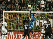 Austin FC goalkeeper Brad Stuver goes up for a save during the first half of an MLS soccer match against the LA Galaxy, Sunday, Sept. 26, 2021, in Austin, Texas. (AP Photo/Michael Thomas)