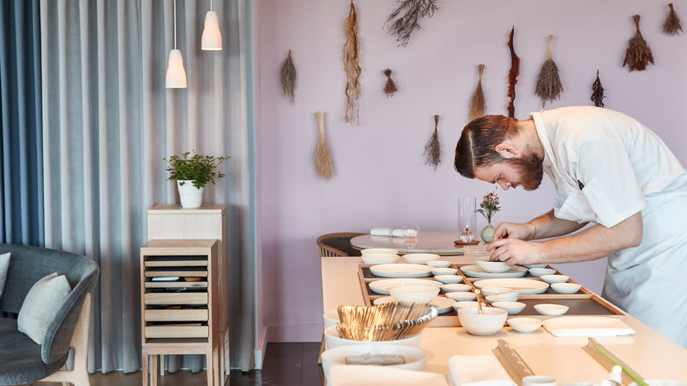 Chef plating in Geranium’s open kitchen - Credit: Courtesy Claes Bech Poulsen