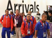 Members of the Cuban Olympic weightlifting team arrive at Heathrow Airport on July 16, 2012 in London, England. Athletes, coaches and Olympic officials are beginning to arrive in London ahead of the Olympics. (Photo by Peter Macdiarmid/Getty Images)