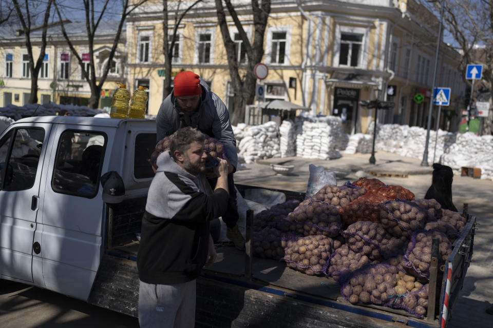 FILE - Volunteers load a truck with potatoes in Odesa, on March 24, 2022. The Black Sea port is mining its beaches and rushing to defend itself from a Mariupol-style fate. Some Western officials believe the city, which is dear to Ukrainians' hearts, could be next. (AP Photo/Petros Giannakouris, File)