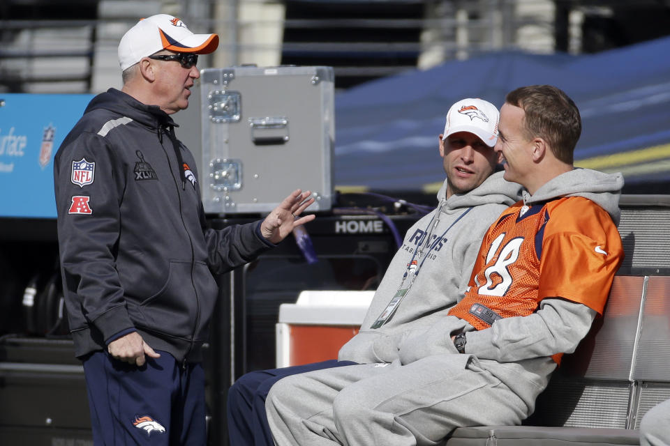 Denver Broncos head coach John Fox, left, talks with quarterback Peyton Manning (18) in MetLife Stadium on Saturday, Feb. 1, 2014, in East Rutherford, N.J. The Broncos are scheduled to play the Seattle Seahawks in the NFL Super Bowl XLVIII football game Sunday. (AP Photo/Mark Humphrey)