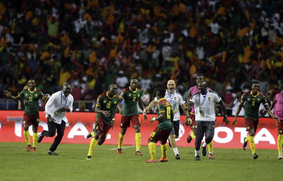 Cameroon players and staff celebrate after Vincent Aboubakar, 3rd left, scored their second goal during the African Cup of Nations final soccer match between Egypt and Cameroon at the Stade de l'Amitie, in Libreville, Gabon, Sunday, Feb. 5, 2017. (AP Photo/Sunday Alamba)