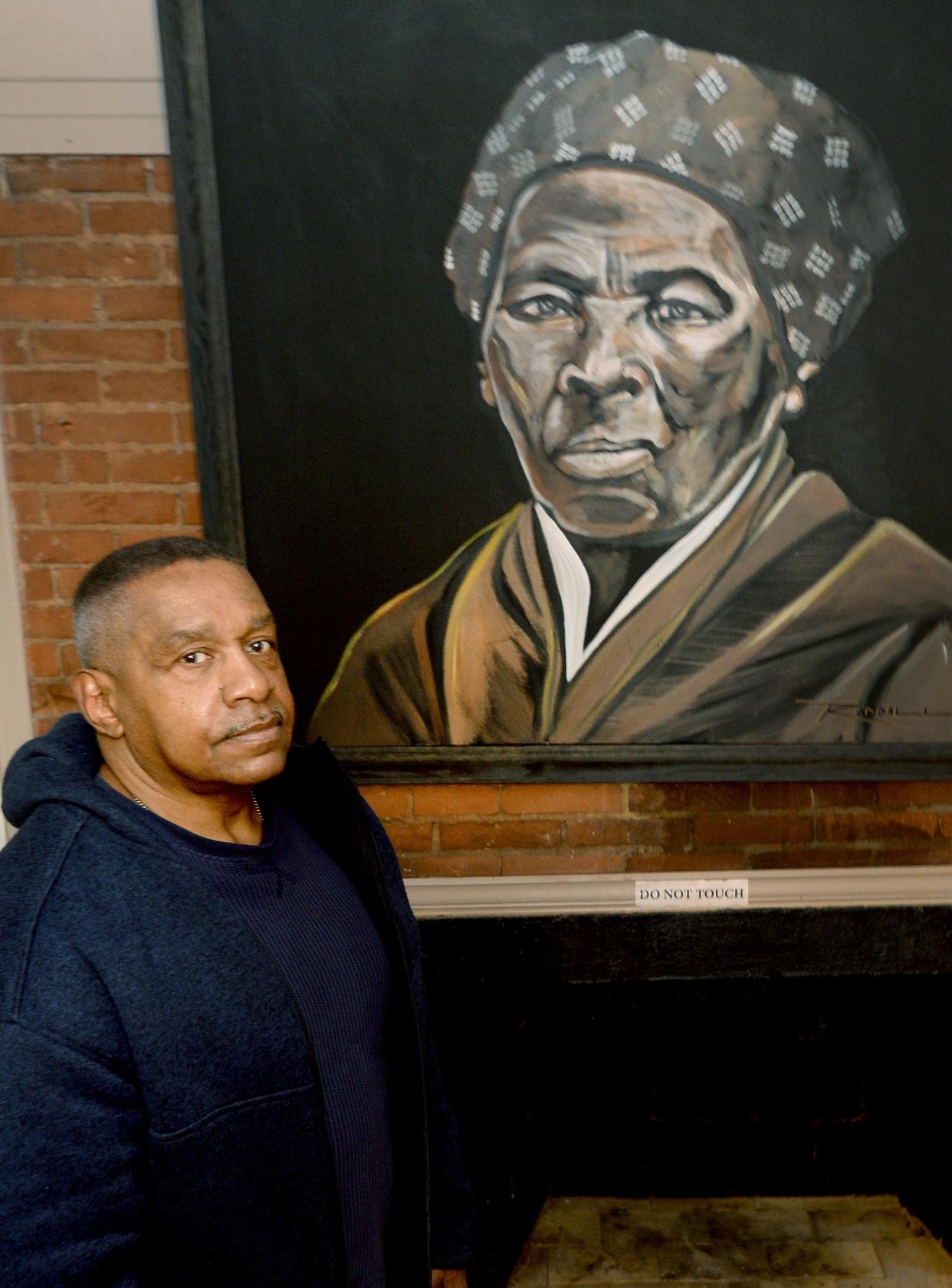 Founding Executive Director of the Jacksonville African American Historic Museum Art Wilson stands in front of a portrait of Harriet Tubman at the museum Tuesday, January 30, 2024.