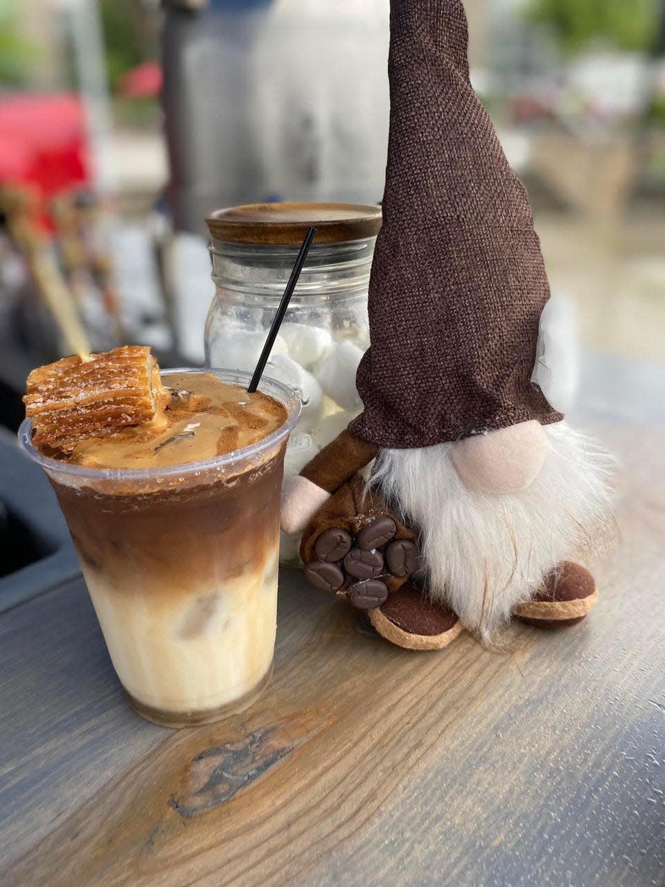 Murray the Coffee Gnome oversees all coffee operations at Coffee in a Cloud, including production of this Caramel Churro latte, which the mobile coffee stand offered as a Flavor of the Week in July 2023.