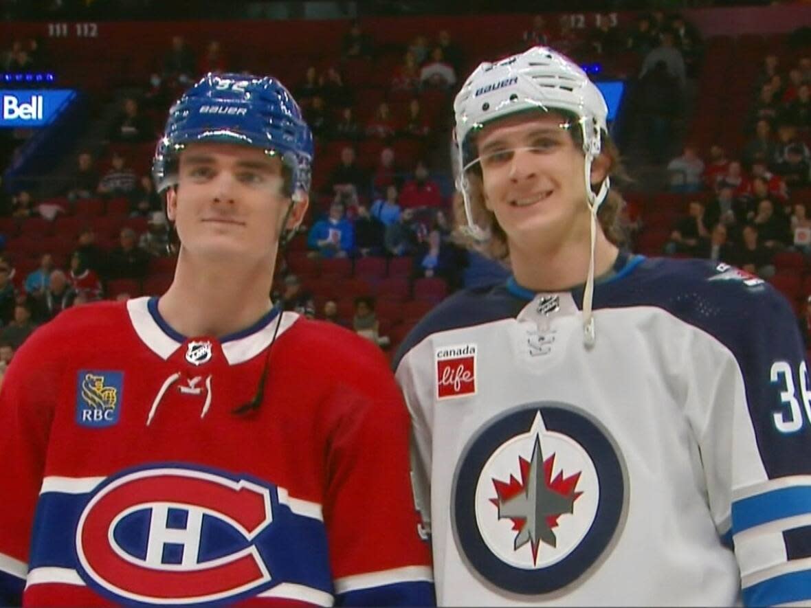 Justin Barron, left, and his brother Morgan Barron took time for a photo before Tuesday night's game.   (TSN - image credit)