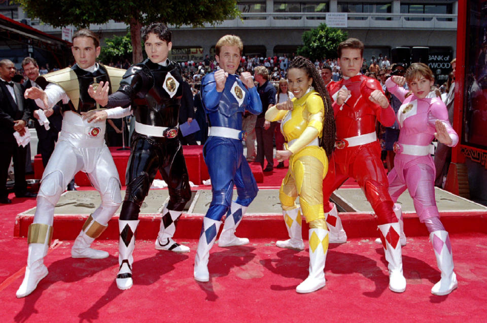 The Mighty Morphin Power Rangers strike a pose after they placed their hands and feet in cement during ceremonies at Mann's Chinese Theatre in Hollywood June 22. Shown (L-R) White Power Ranger, Jason Frank; Black, Johnny Bosch; Blue, David Yost; Yellow, Karan Ashley; Red, Steve Cardenas and Pink, Amy Johnson