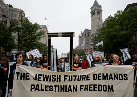 People organized by IfNotNow protest outside of Trump International Hotel against the new U.S. Embassy opening in Jerusalem in Washington, U.S., May 14, 2018. REUTERS/Leah Millis