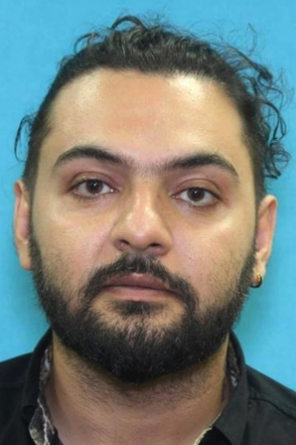 This undated photo released by the Redmond Police Department shows Ramin Khodakaramrezaei, 38. The longhaul truck driver from Texas who became obsessed with a software engineer after meeting her through a social media chatroom app killed her, her husband and himself in Redmond, Wash., after stalking them for months, police said. (Redmond Police Departemnet via AP)