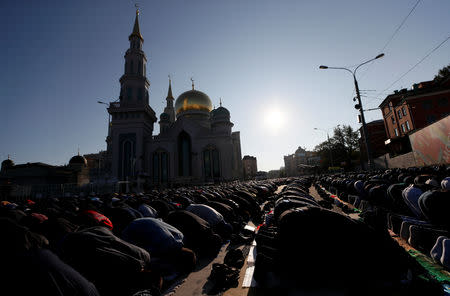 People attend prayers for the Muslim holiday of Eid al-Adha in Moscow, Russia September 1, 2017. REUTERS/Maxim Shemetov/Files