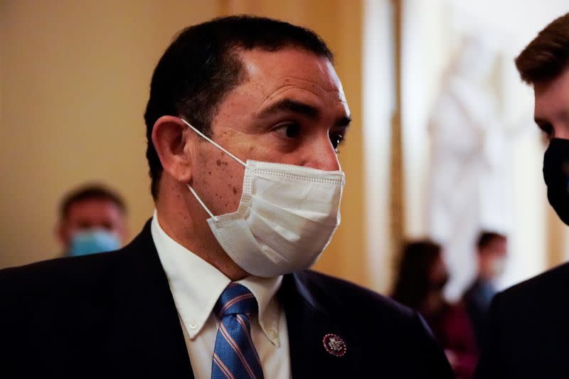 FILE PHOTO: U.S. Representative Cuellar stops to talk to reporters on his way vote on the House floor at the U.S. Capitol in Washington