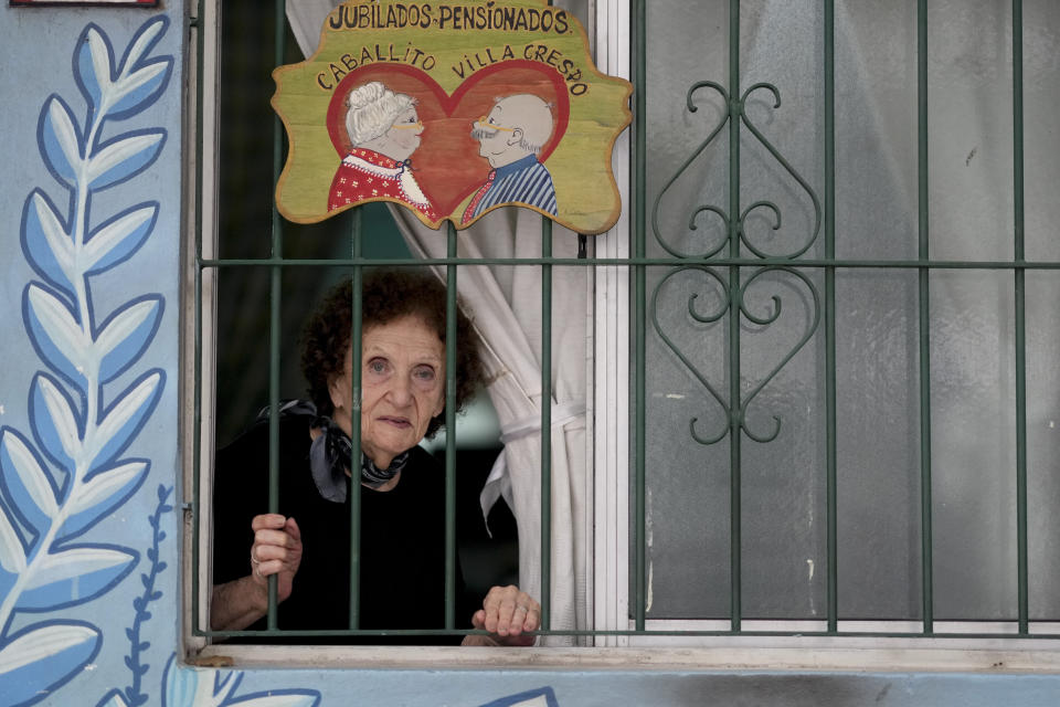 Paulina Najnudel poses for a portrait at the Caballito and Villa Crespo, a recreational day center for retirees, in Buenos Aires, Argentina, Wednesday, April 12, 2023. The 85-year-old said she worked as a clothing designer and had her own factory until 2001 and that now she can't afford to pay rent, utilities and daily expenses, adding that it's "sad" after having worked so many years. Today, her children support her financially. (AP Photo/Natacha Pisarenko)