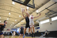 Yeshiva forward Gabriel Leifer (4) and Worcester Polytechnic Institute guard John Wessel (25) battle for rebound during the first half in a first-round game at the men's Division III NCAA college basketball tournament at Johns Hopkins University's Goldfarb Gymnasium, Friday, March 6, 2020, in Baltimore. The university held the tournament without spectators after cases of COVID-19 were confirmed in Maryland. (AP Photo/Terrance Williams)