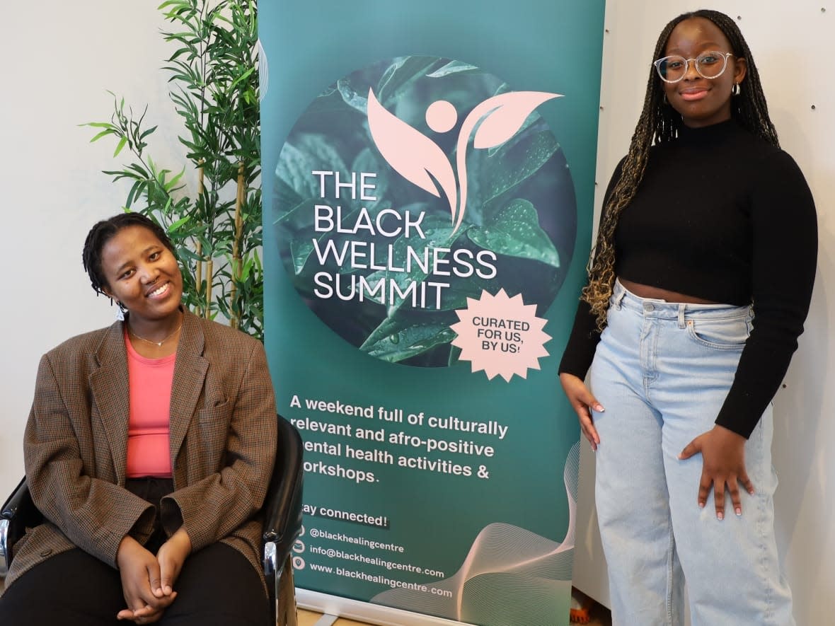 Samanta Nyinawumuntu, left, and Katya Stella Assoé, right, founded the Black Healing Centre —  a space that provides free and subsidized therapy tailored to Black people and their experiences. They're pictured at the first Black Wellness Summit in Montreal in February. (Radha Agarwal - image credit)