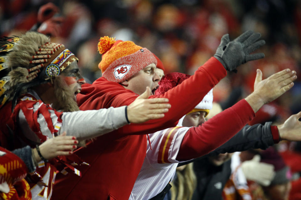 FILE - In this Dec. 13, 2018, photo, Kansas City Chiefs fans chant and do the chop during the second half of the team's NFL football game against the Los Angeles Chargers in Kansas City, Mo. The Kansas City Chiefs have since barred headdresses and war paint amid the nationwide push for racial justice, but its effort to make its popular “war chant” more palatable is getting a fresh round of scrutiny from Native American groups as the team prepares to make its second straight Super Bowl appearance. (AP Photo/Charlie Riedel, File)