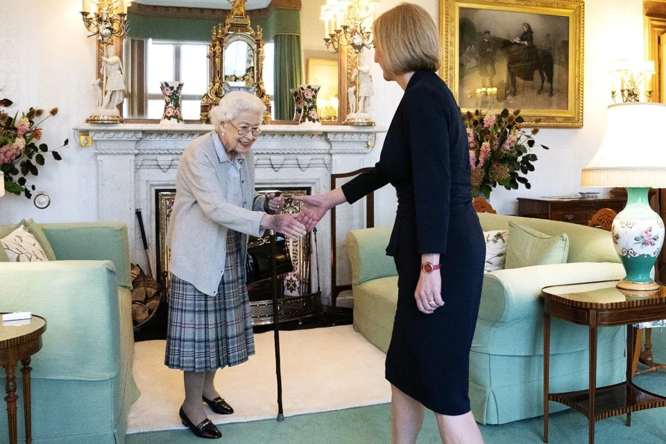 ABERDEEN, SCOTLAND - SEPTEMBER 06: Queen Elizabeth greets newly elected leader of the Conservative party Liz Truss as she arrives at Balmoral Castle for an audience where she will be invited to become Prime Minister and form a new government on September 6, 2022 in Aberdeen, Scotland. The Queen broke with the tradition of meeting the new prime minister and Buckingham Palace, after needing to remain at Balmoral Castle due to mobility issues. (Photo by Jane Barlow - WPA Pool/Getty Images)