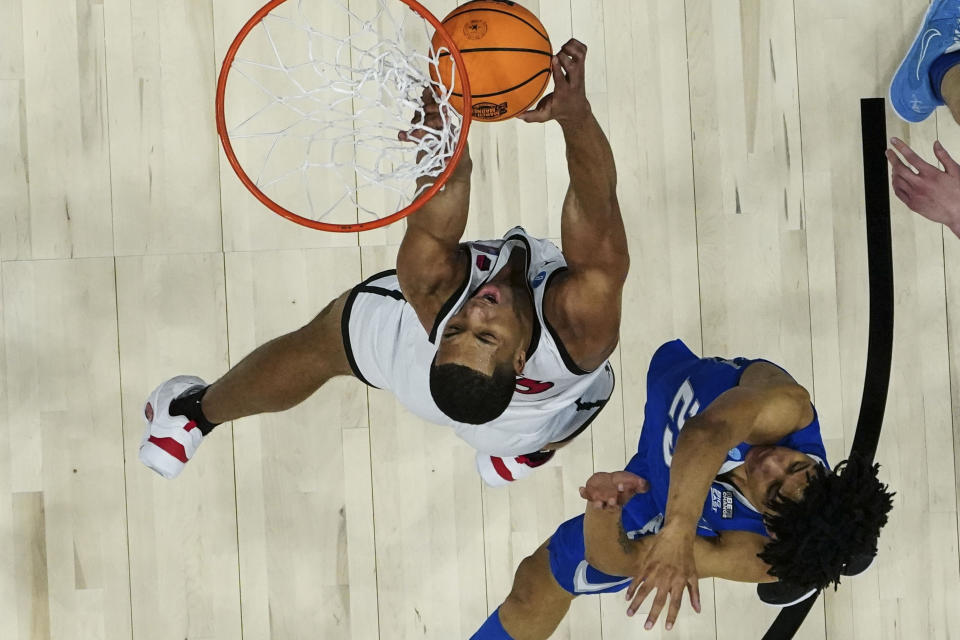 San Diego State forward Jaedon LeDee (13) vies for the ball against Creighton guard Trey Alexander (23) in the first half of a Elite 8 college basketball game in the South Regional of the NCAA Tournament, Sunday, March 26, 2023, in Louisville, Ky. (AP Photo/John Bazemore)