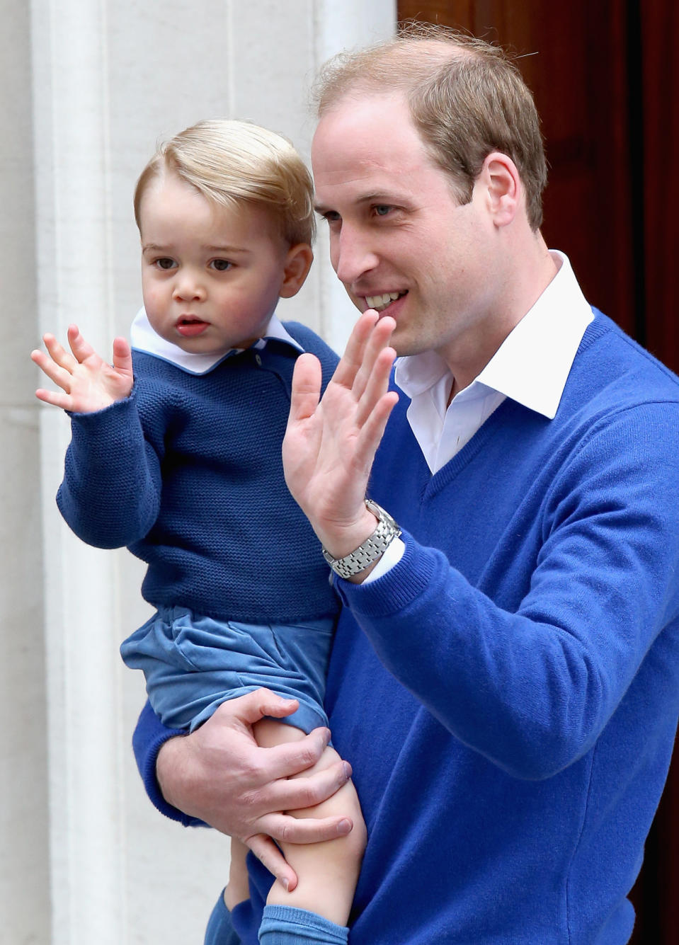 Prince George wearing the blue cardigan when he went to meet his sister for the first time at the hospital in 2015. (Photo: Getty Images)