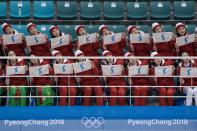 <p>North Korean cheerleaders wave flags showing a unified Korean peninsula as they perform following the women’s preliminary round ice hockey match between the unified Korea team and Switzerland at the Pyeongchang 2018 Winter Olympics, at the Gangneung Ice Arena in Gangneung on February 10, 2018. </p>