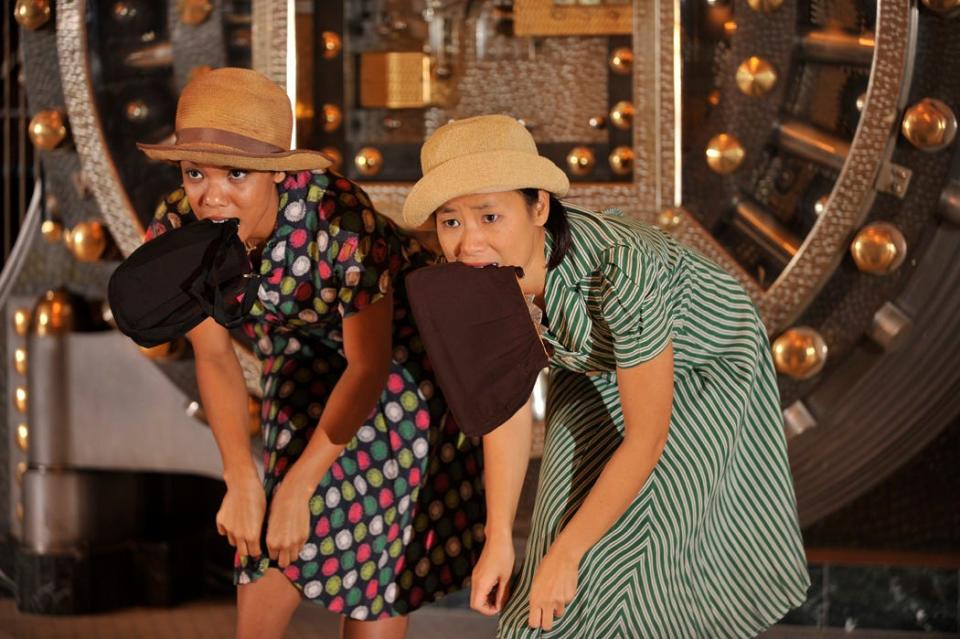 Yeng Vang-Strath, right, and Nastassja Bates perform in 2010 during a Wild Space Dance concert in the newly renovated Milwaukee County Historical Society, a former bank building.