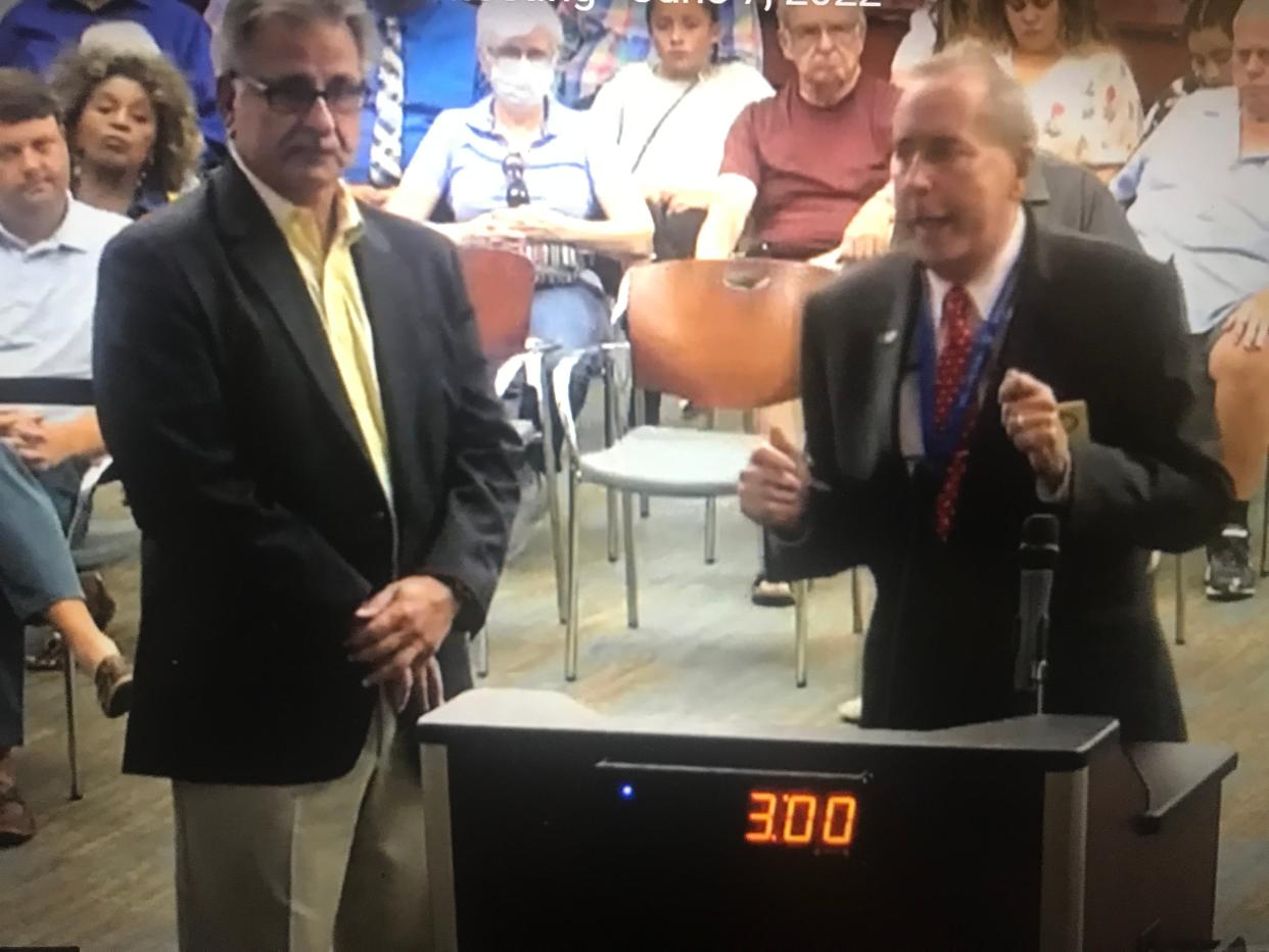 Pastor Charles Silano and Palm Coast Mayor David Alfin during a presentation about the food-a-thon last month.