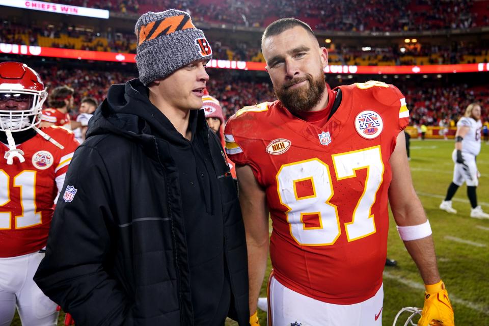 Cincinnati Bengals quarterback Joe Burrow, left, talks with Kansas City Chiefs tight end Travis Kelce at the conclusion of a Week 17 game where the Chiefs won 25-17 last Dec. 31. Burrow was out injured.
