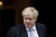 British Prime Minister Boris Johnson walks out to greet NATO Secretary General Jens Stoltenberg before their meeting at 10 Downing Street in London, Tuesday, Oct. 15, 2019. (AP Photo/Matt Dunham)