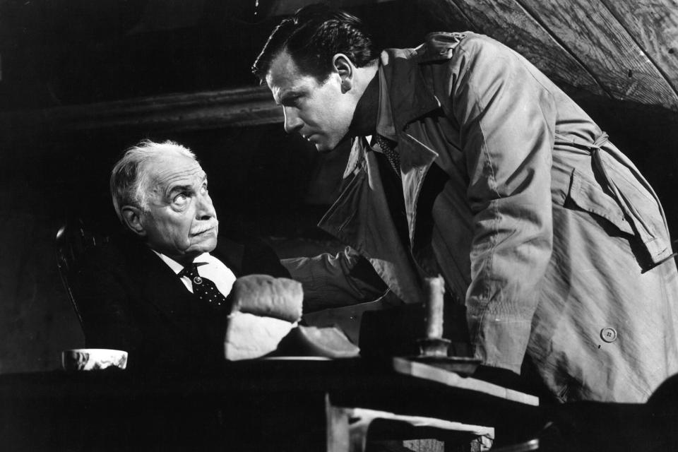 Joel McCrea staring down at old man in a scene from the film 'Foreign Correspondent', 1940. (Photo by United Artists/Getty Images)