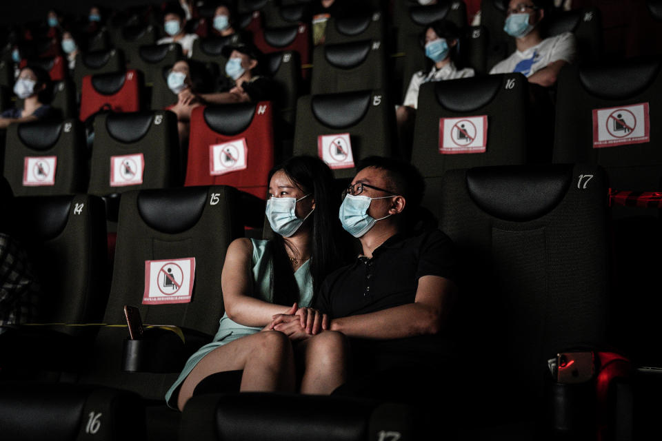 WUHAN, CHINA - JULY 20: (CHINA OUT)Residents watch a movie in a cinema in Wuhan on July 20, 2020 in Wuhan ,Hubei Province,China.Taking various measures against COVID-19, cinemas in the city reopened in an orderly manner on Monday. The China Film Administration, in a circular last week, allowed cinemas in low-risk areas to resume operation with effective epidemic prevention measures in place. (Photo by Getty Images)