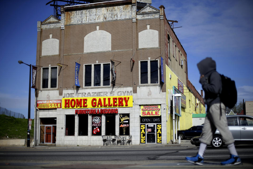 Shown is a present day furniture store and the former gym where heavyweight champ Joe Frazier lived and trained, on Tuesday, April 30, 2013, in Philadelphia. The gym has been named to the National Register of Historic Places. (AP Photo/Matt Rourke)