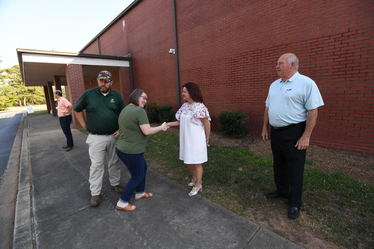 Sheri Biggs shakes hands with Jessica Brown with Adam Brown at the Centerville Precinct in Anderson Tuesday, June 25, 2024.