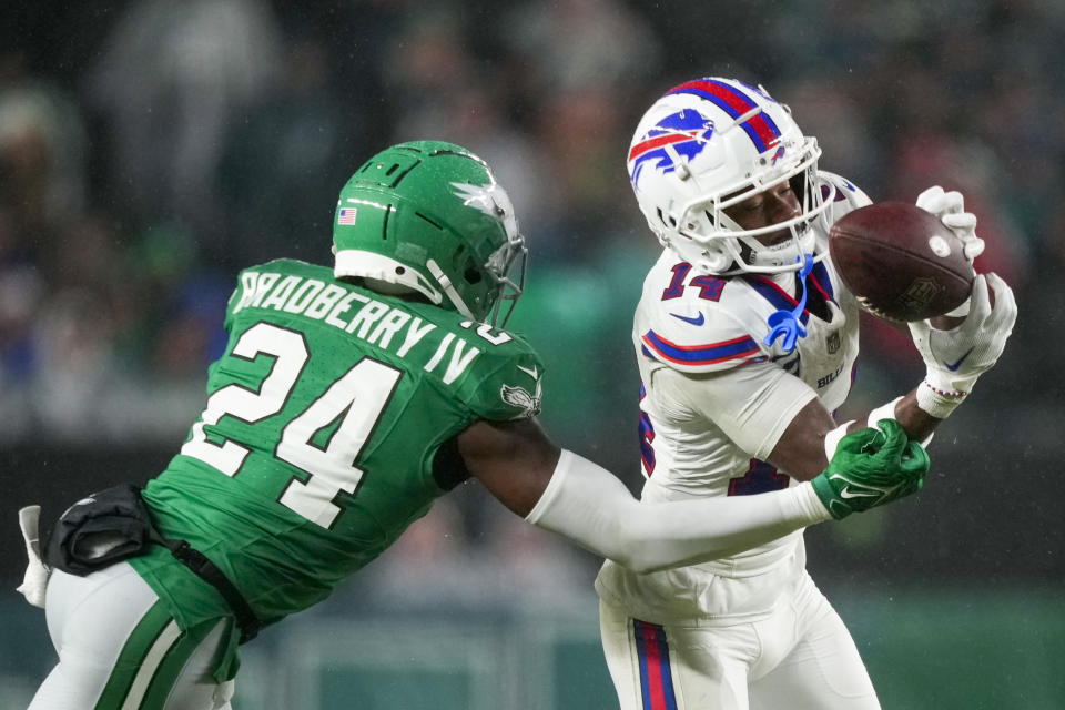 Buffalo Bills wide receiver Stefon Diggs catches a pass in front of Philadelphia Eagles cornerback James Bradberry during the first half of an NFL football game Sunday, Nov. 26, 2023, in Philadelphia. (AP Photo/Matt Slocum)