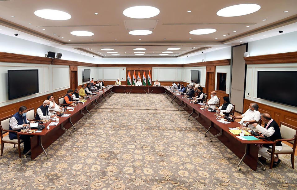 This photograph provided by the Prime Minister's Office shows members of various political parties with Indian Prime Minister Narendra Modi, center, and Home Minister Amit Shah, center right, in New Delhi, India, Thursday, June 24, 2021. India’s prime minister is holding a crucial meeting with pro-India politicians from disputed Kashmir on Thursday for the first time since New Delhi stripped the region’s semi-autonomy and jailed many of them in a crackdown. (Prime Minister's Office via AP)