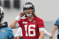 Jacksonville Jaguars quarterback Trevor Lawrence (16) takes a break during an NFL football practice, Monday, June 14, 2021, in Jacksonville, Fla. (AP Photo/John Raoux)