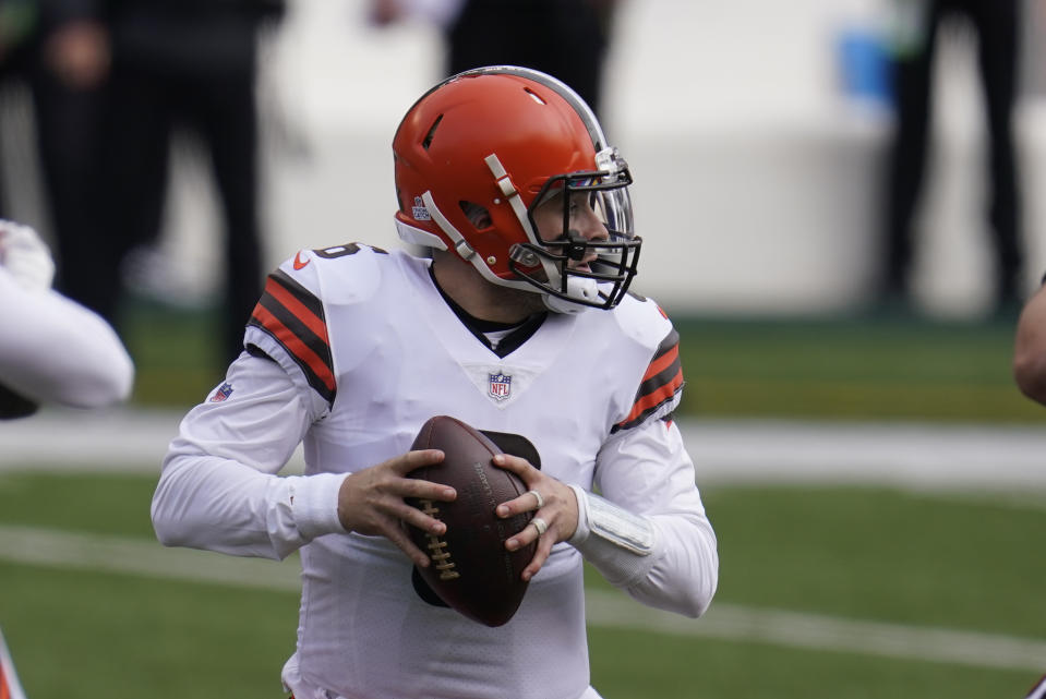 Cleveland Browns quarterback Baker Mayfield (6) looks to throw during the first half of an NFL football game against the Cincinnati Bengals, Sunday, Oct. 25, 2020, in Cincinnati. (AP Photo/Michael Conroy)