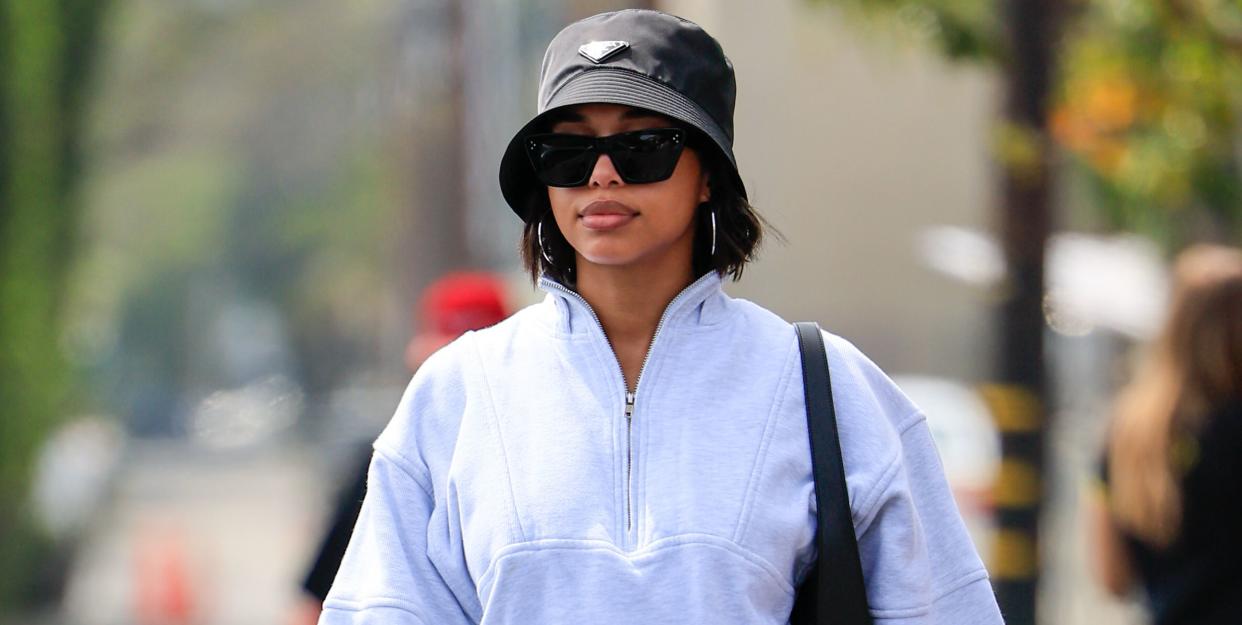 lori harvey wears a prada bucket hat in a guide to trendy hats