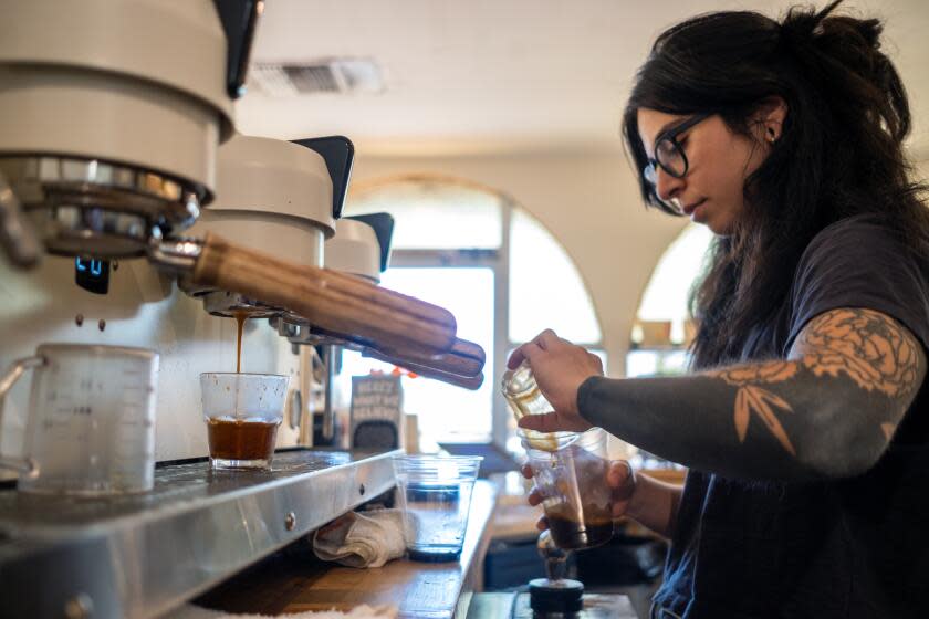 Redlands, CA - July 11: Barista Miranda Castaneda member/owner is working at Slow Bloom Coffee Cooperative, a coffee shop on Tuesday, July 11, 2023, in Redlands, CA. Slow Bloom Coffee Cooperative started from the efforts of Augie's Union a collective of coffee workers. Back then, the shop they worked at closed because the workers tried to unionize at a time when only 3 coffee shops in the United States were unionized. Now there are hundreds. (Francine Orr / Los Angeles Times)