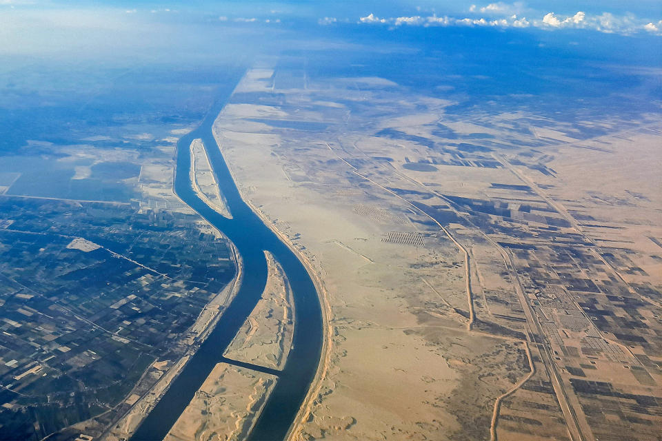 TOPSHOT - This picture taken on March 23, 2024 shows an aerial view of the new extension to the Suez Canal which was inaugurated in 2015 at al-Ferdan, north of Ismailia in northeastern Egypt. (Photo by Khaled DESOUKI / AFP) (Photo by KHALED DESOUKI/AFP via Getty Images)