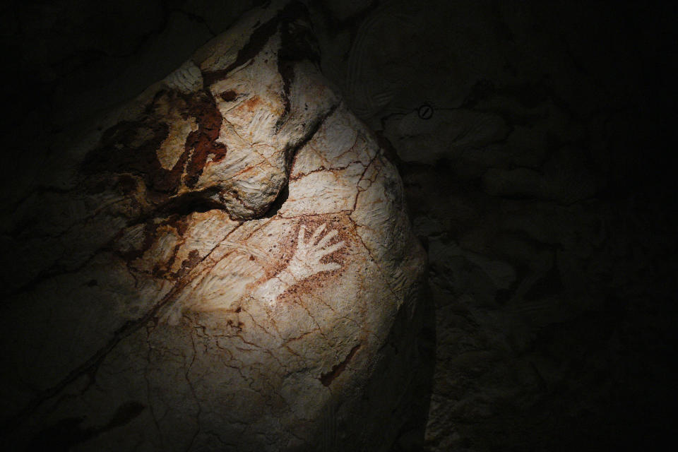 Reproductions of cave drawings are pictured in a replica of the Cosquer Cave in the Villa Mediterranee in Marseille, southern France, Thursday, June 2, 2022. storic paintings that made the cave internationally famous. The Cosquer Cave was discovered in 1985 by diver Henri Cosquer, nestled deep in the sea under the Marseille coastline. (AP Photo/Daniel Cole)