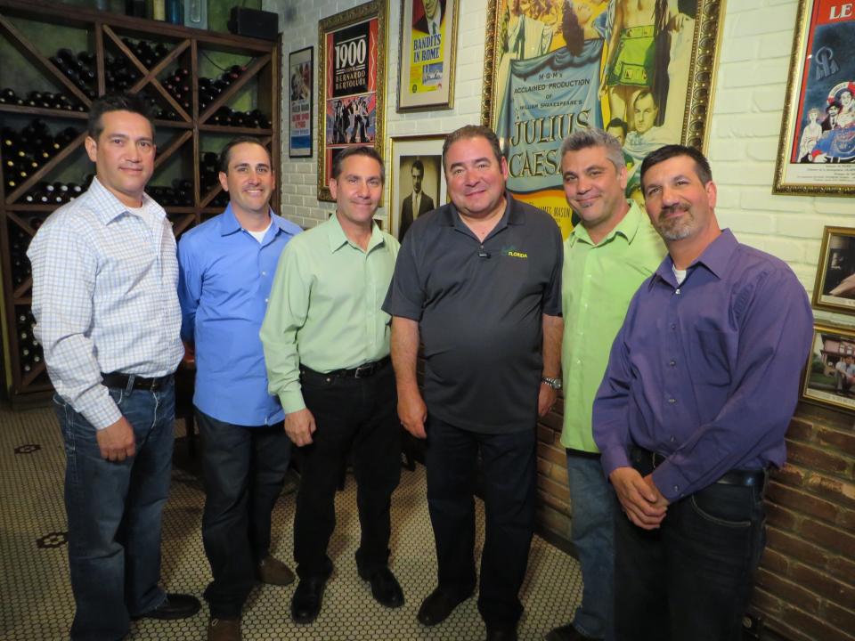 The Caragiulo brothers pose with Emeril Lagasse at their restaurant in downtown Sarasota in 2015. From left, it's Rob, Paul, John, Emeril, Mark, and Anthony.