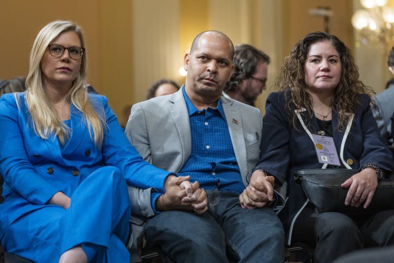 A federal judge in Washington, D.C., dismissed three of the five claims Tuesday in a lawsuit filed by Sandra Garza (R), the long-time partner of fallen Capitol Police Officer Brian Sicknick, including a wrongful death claim against former President Donald Trump following the Jan. 6, 2021, riots. File photo by Pat Benic/UPI